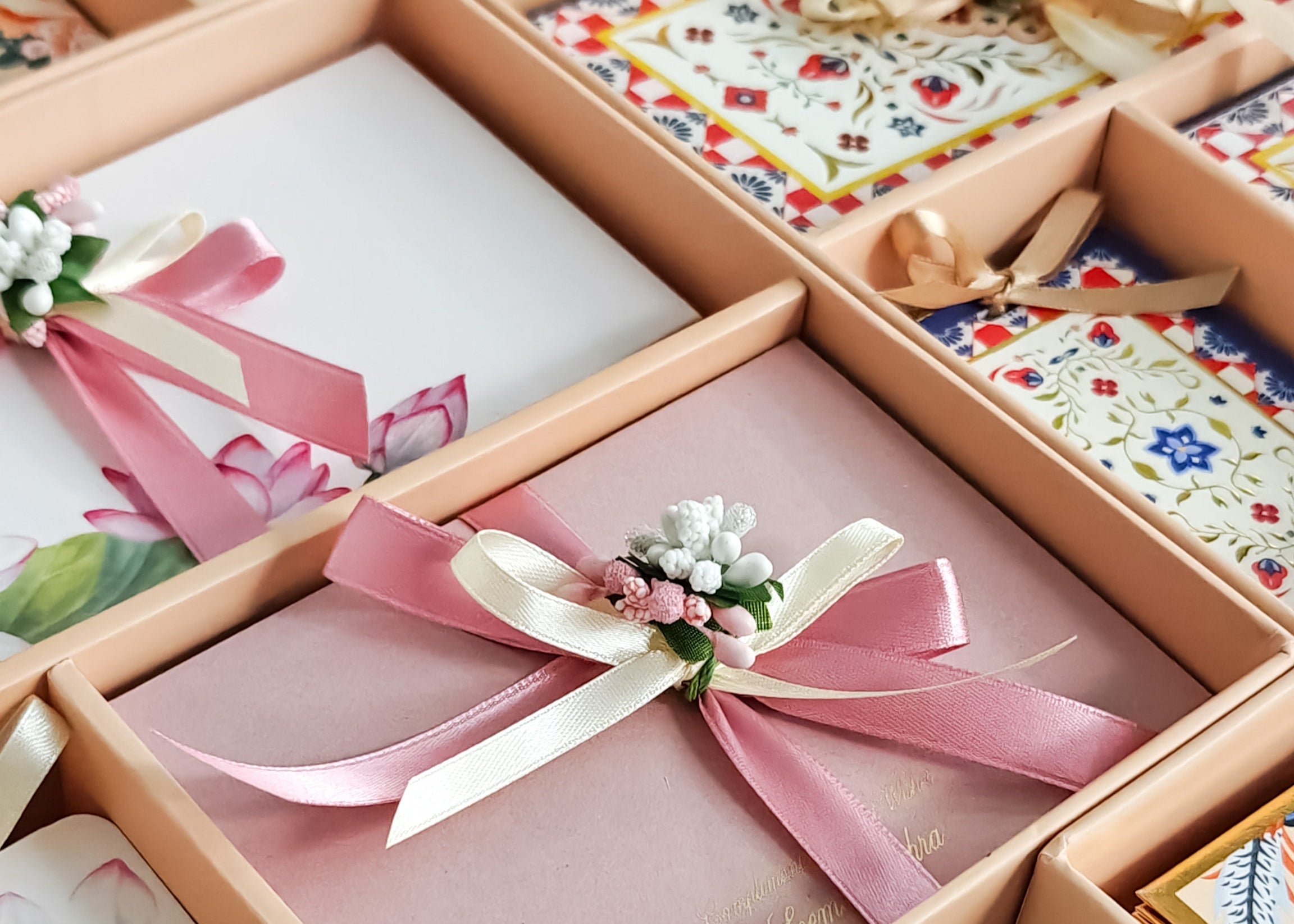 Gift boxes with ribbons and decorative bows on a white surface