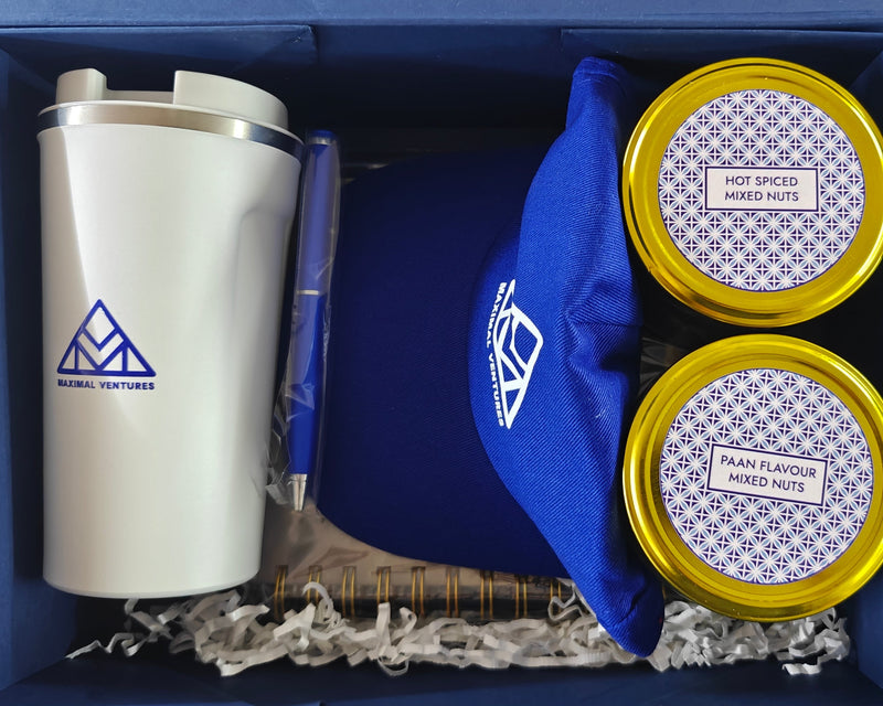 Tins of dry fruit, customised cap, coffee sipper and planner. 